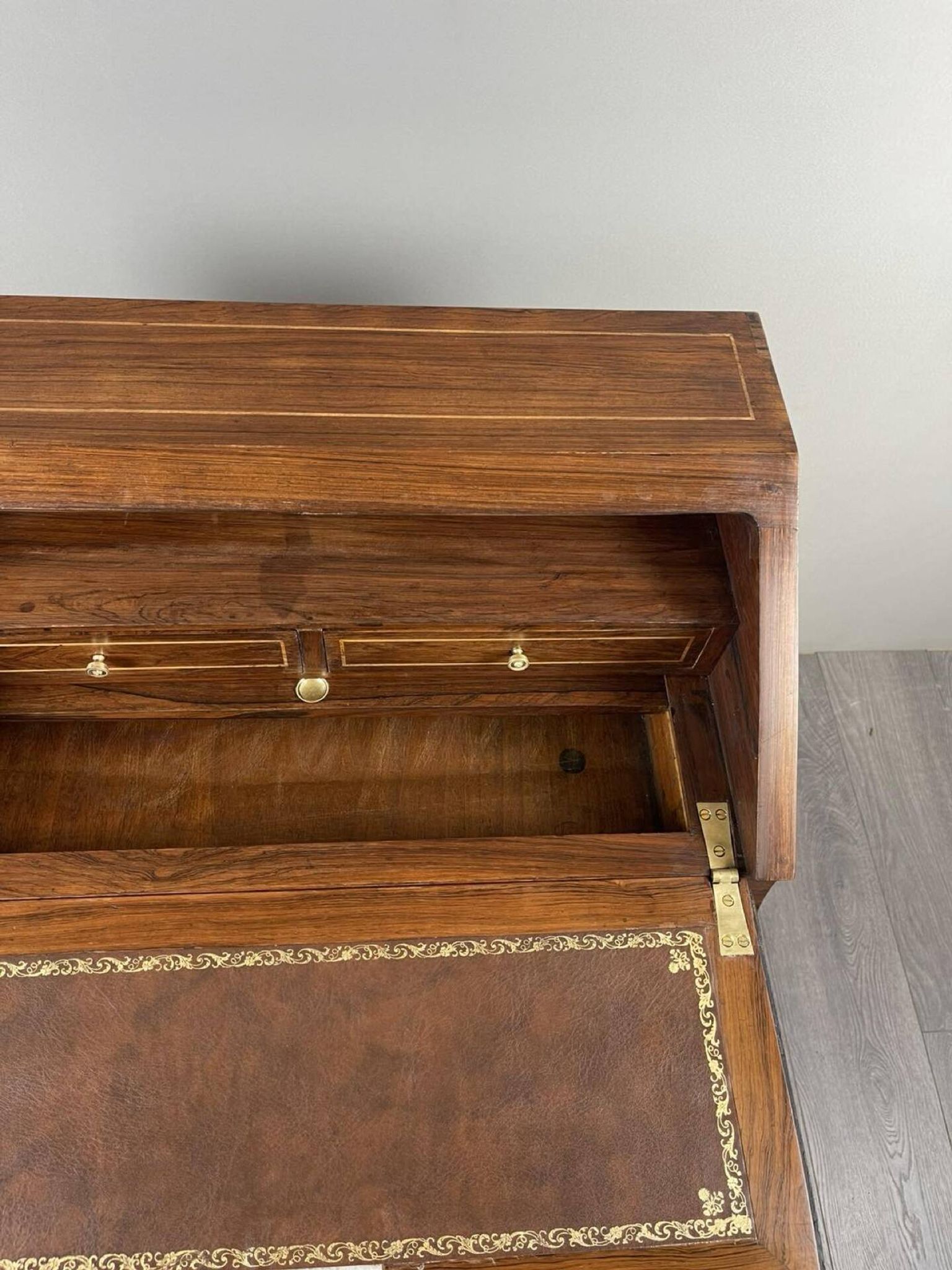 Secretary with a drop-down front in marquetry, Louis XV style, 19th century.