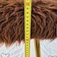 Vintage shaggy chair in faux fur with golden metal legs.