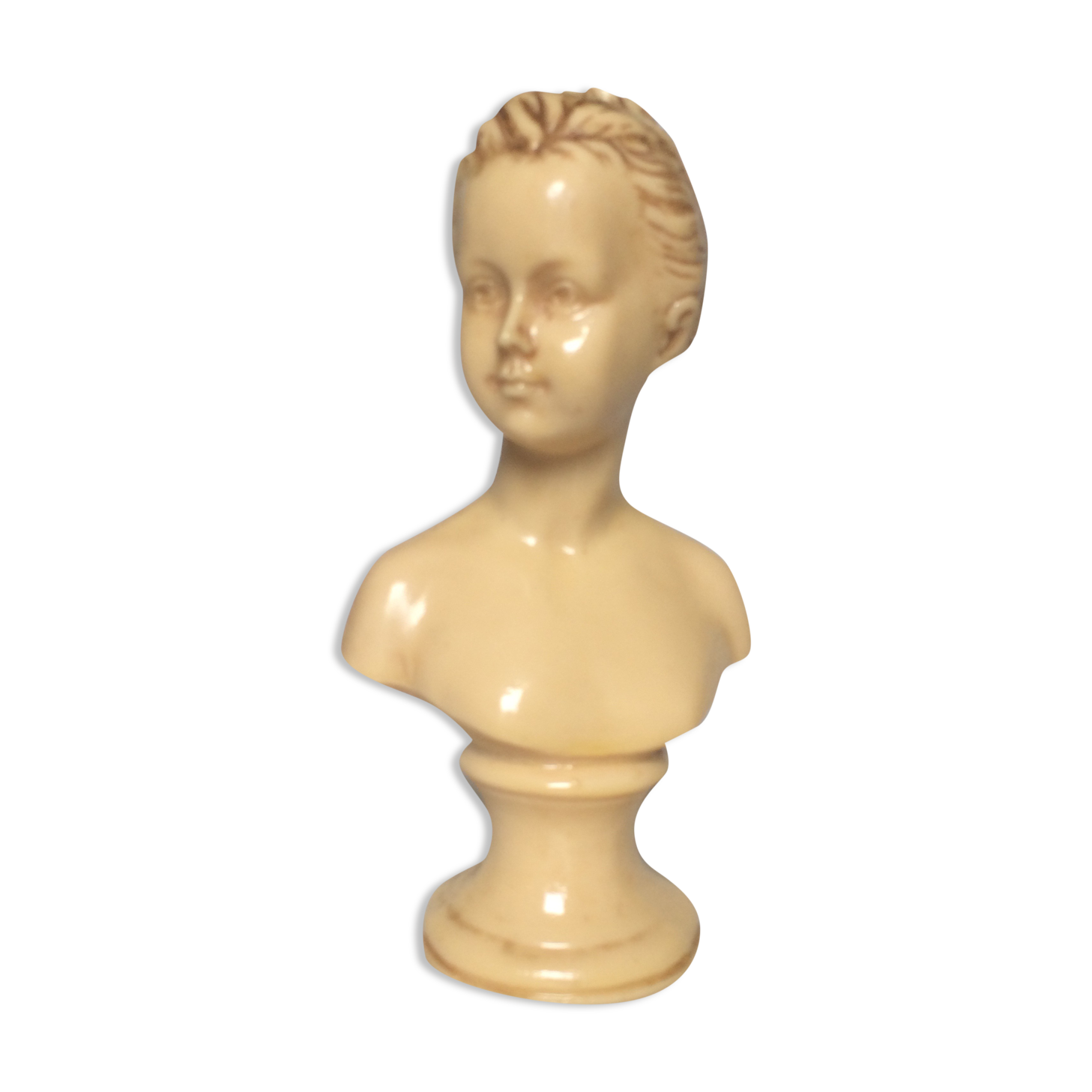 Bust in varnished dish, young girl with bun
