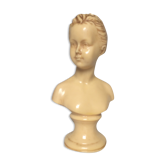 Bust in varnished dish, young girl with bun
