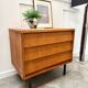 Modernist chest of drawers with slanted drawers