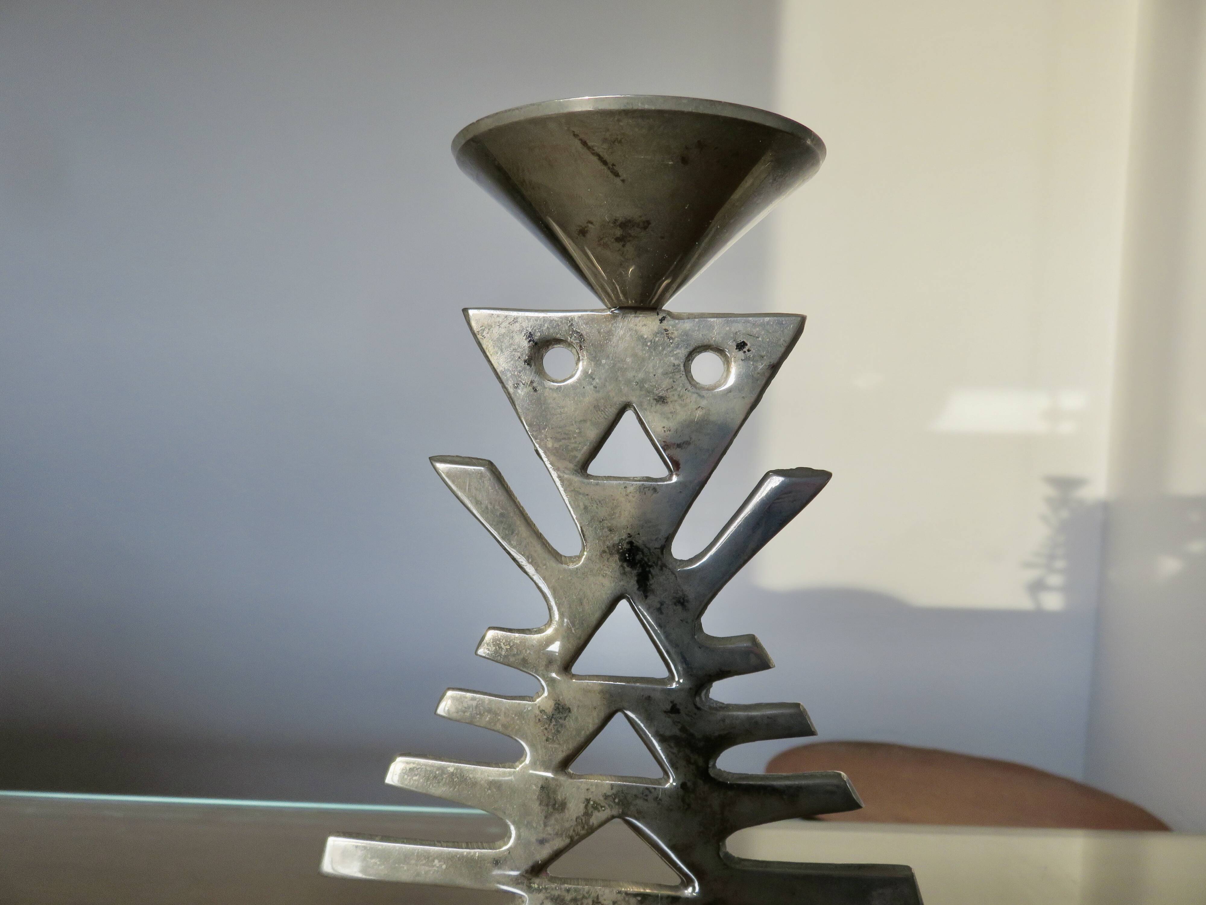 Ethnic “skeleton” candle holder in nickel-plated brass from the 80s