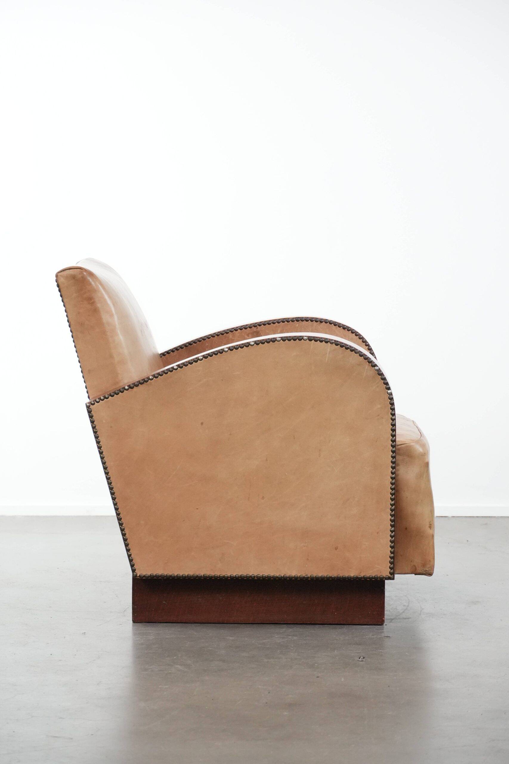 Art Deco design armchair made of cowhide leather in light cognac colour