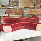 Former pair of burgundy ceramic candlesticks