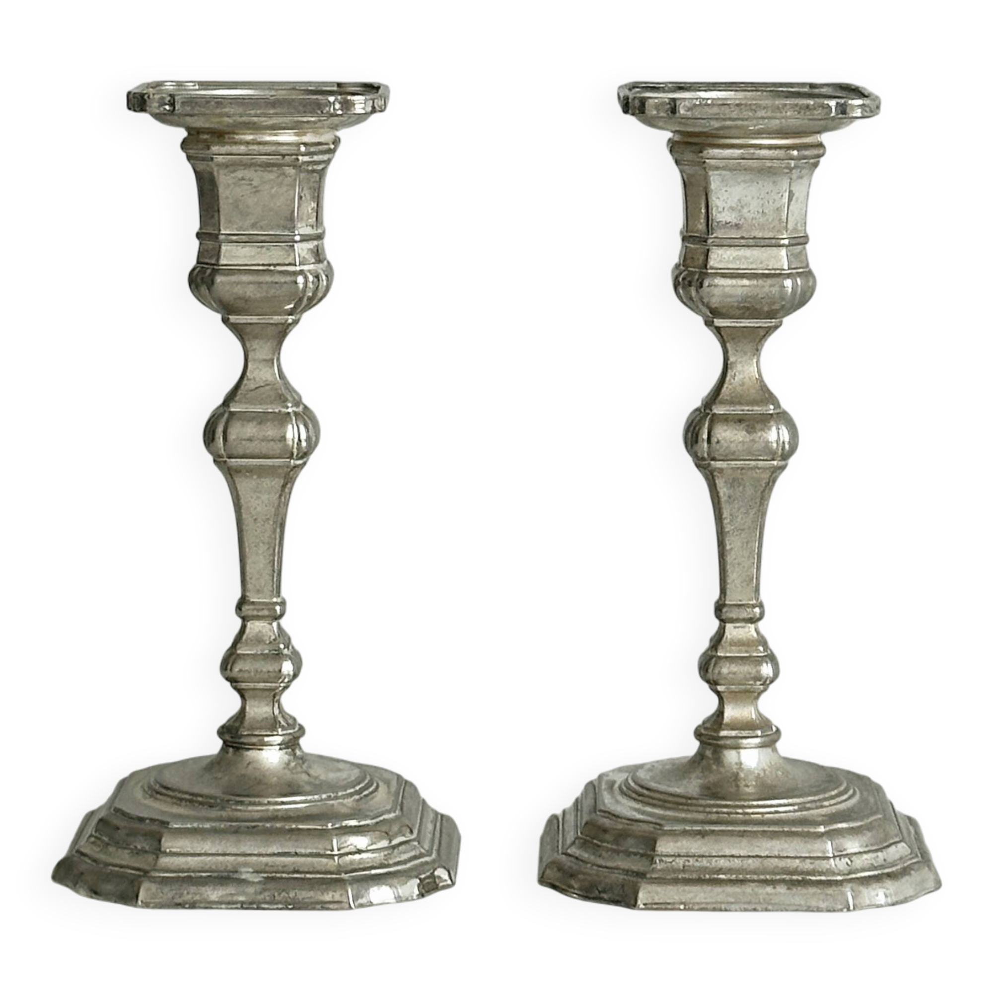 Pair of patinated silver-plated candlesticks
