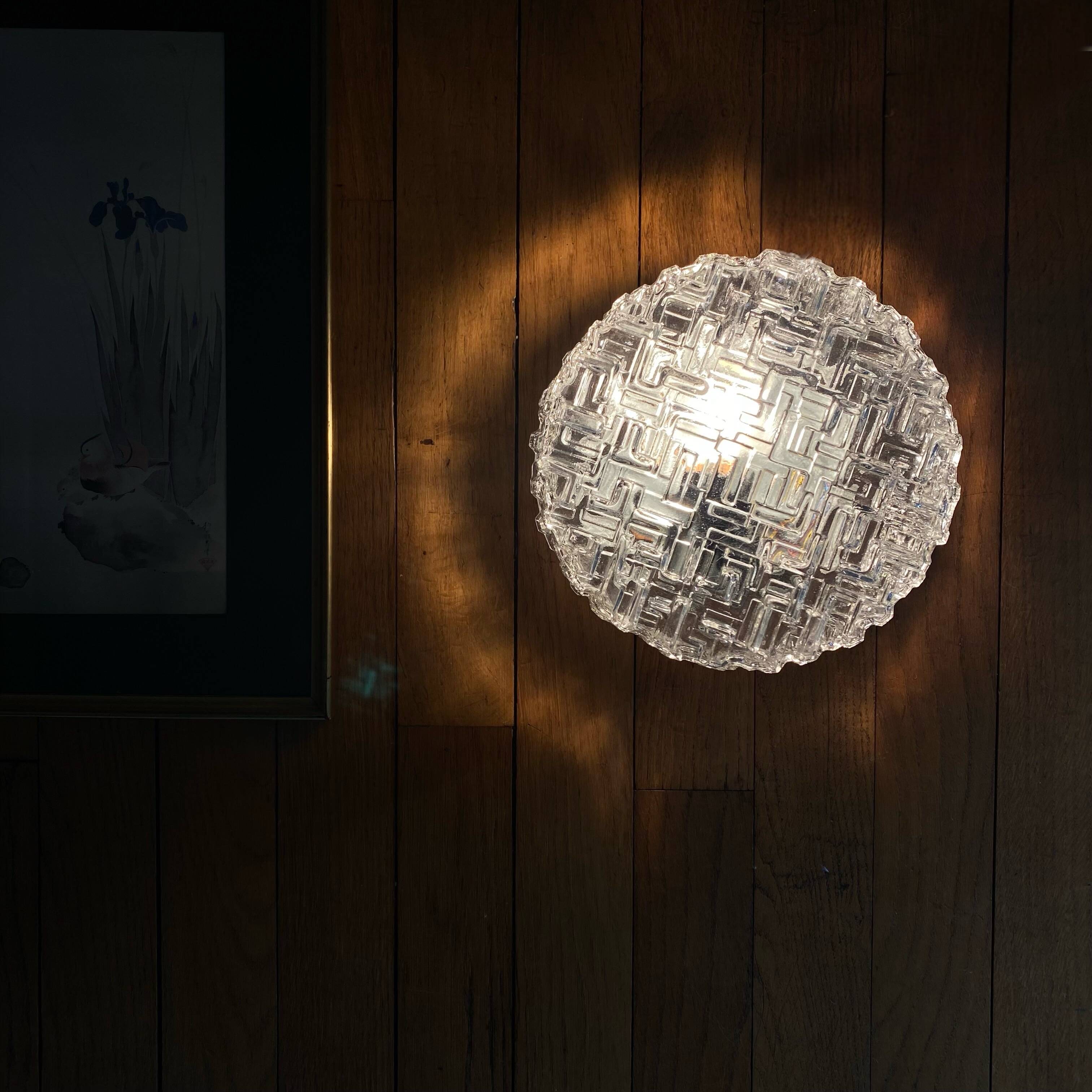 Wall lamp or ceiling light with minimalist porthole glass.