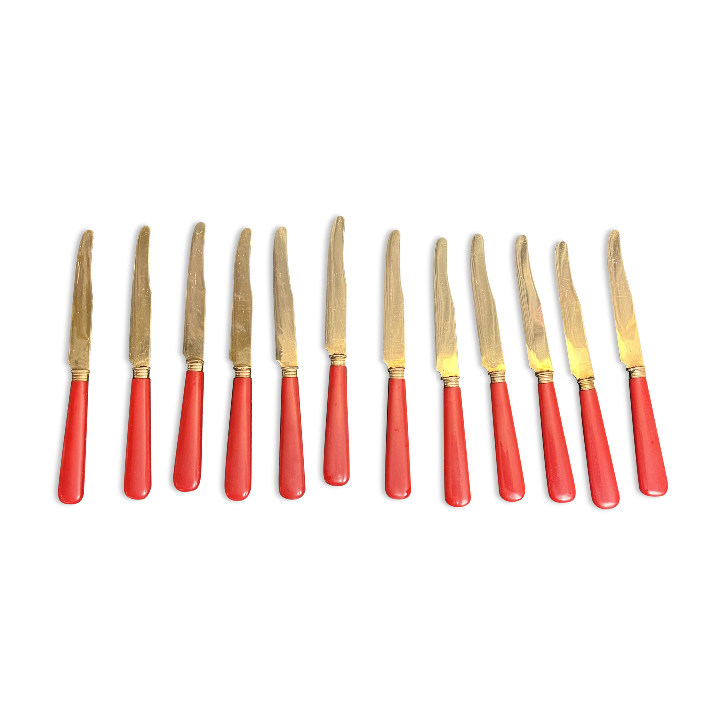 Tableware, twelve vermeil dessert knives in a case from around 1940.