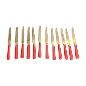 Tableware, twelve vermeil dessert knives in a case from around 1940.