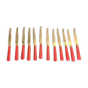 Tableware, twelve vermeil dessert knives in a case from around 1940.