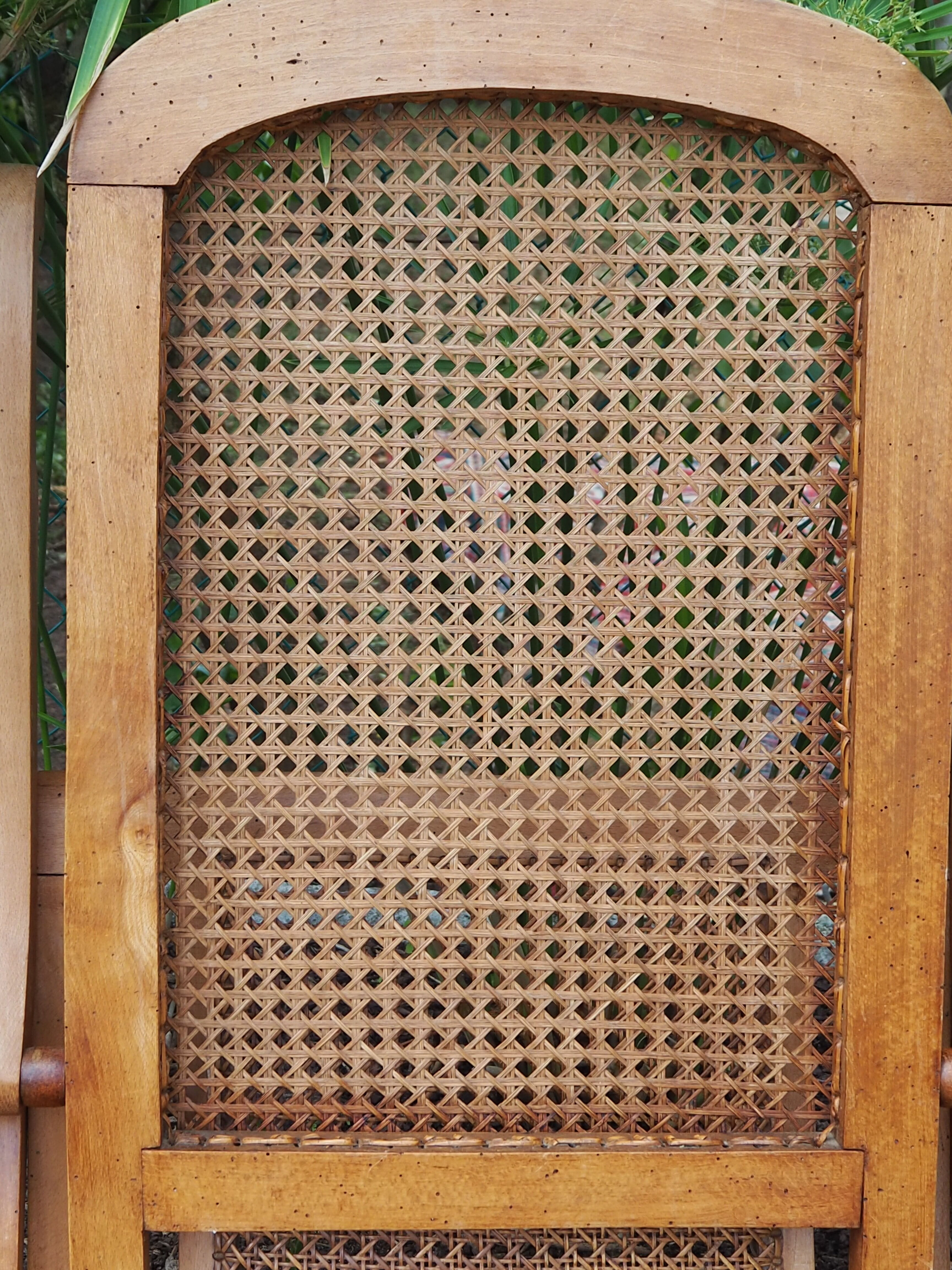 Cane folding armchair in solid wood