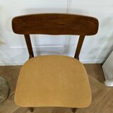 Scandinavian chair with mustard yellow fabric