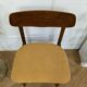 Scandinavian chair with mustard yellow fabric