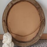 Antique oval gilded stucco mirror