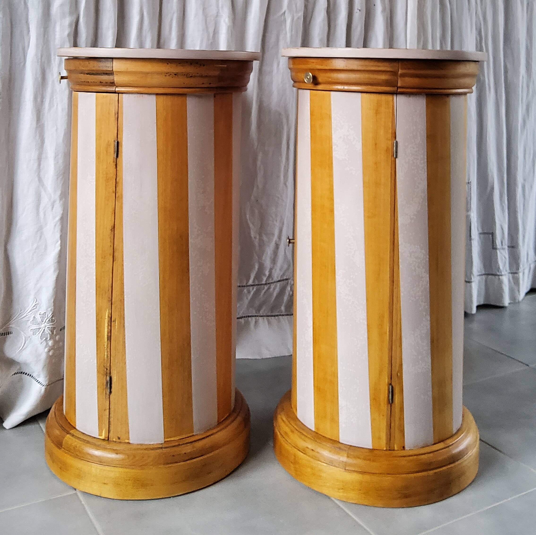 A pair of distressed bedside tables.