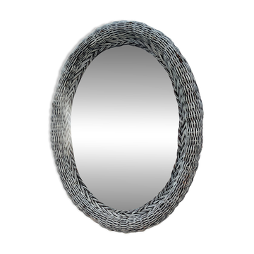 Vintage oval wicker mirror from the 1960s.