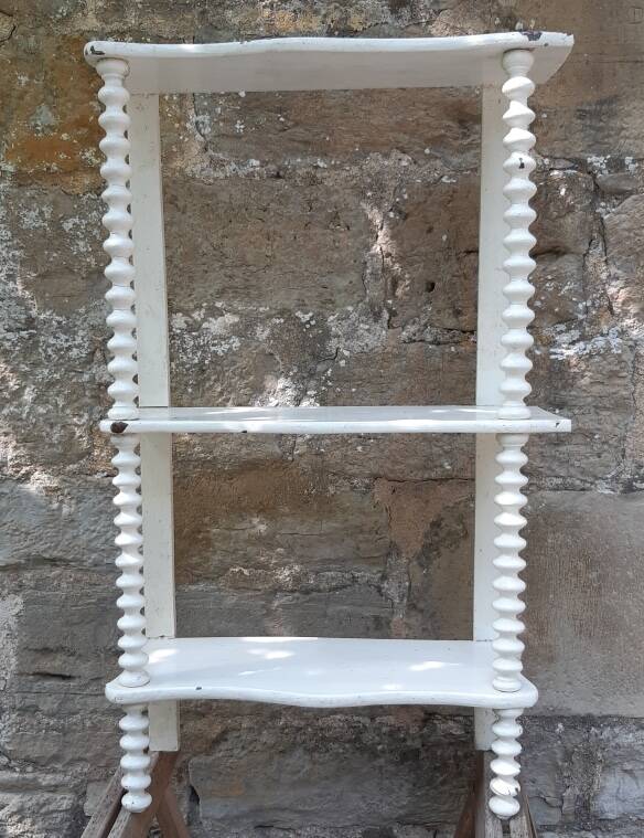 charming curved shelf with 2 turned wooden supports