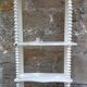 charming curved shelf with 2 turned wooden supports
