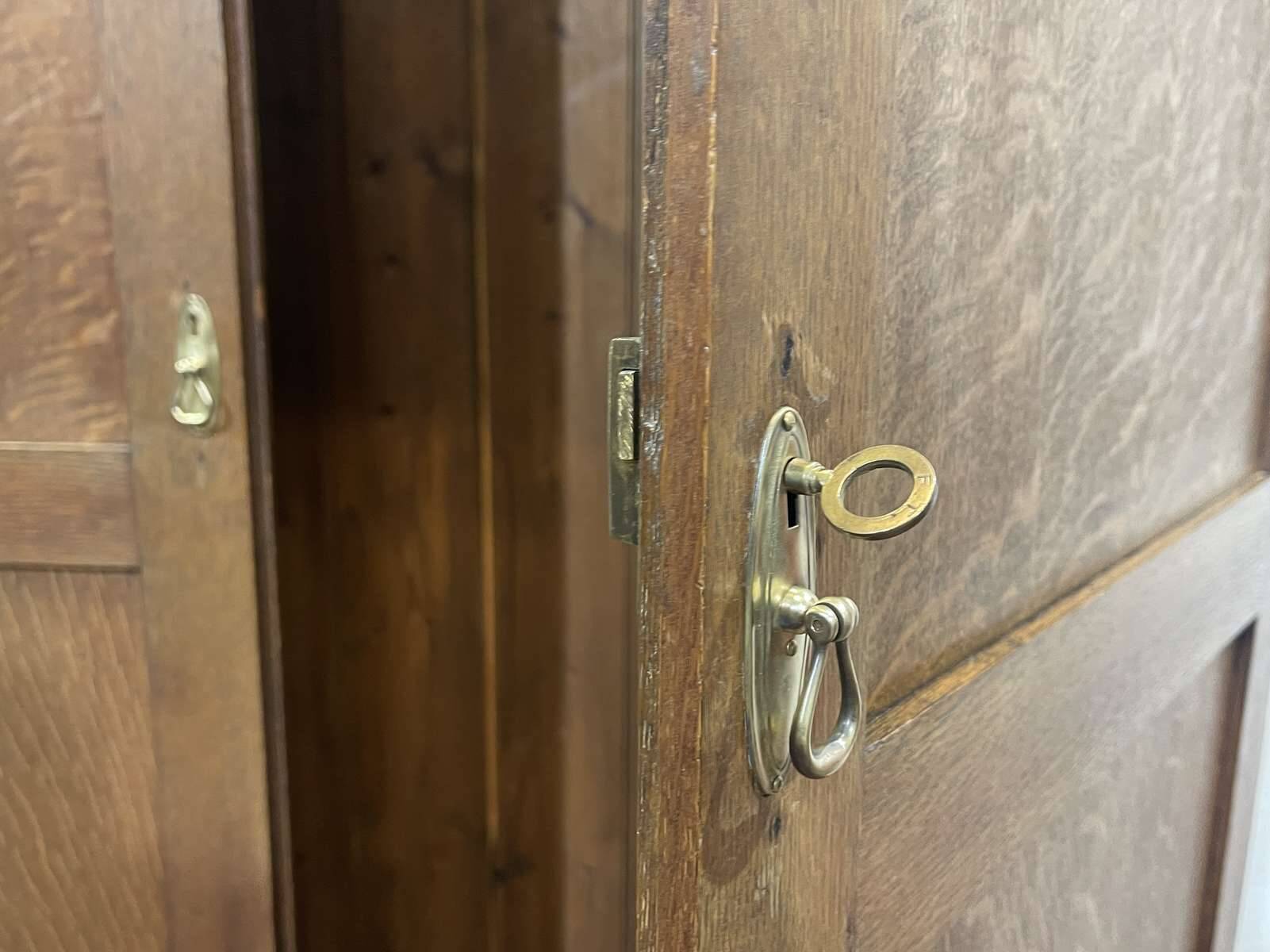 English oak wardrobe from the early 20th century.