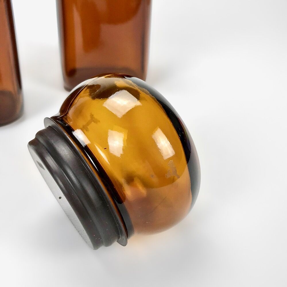 Pair of amber glass jars