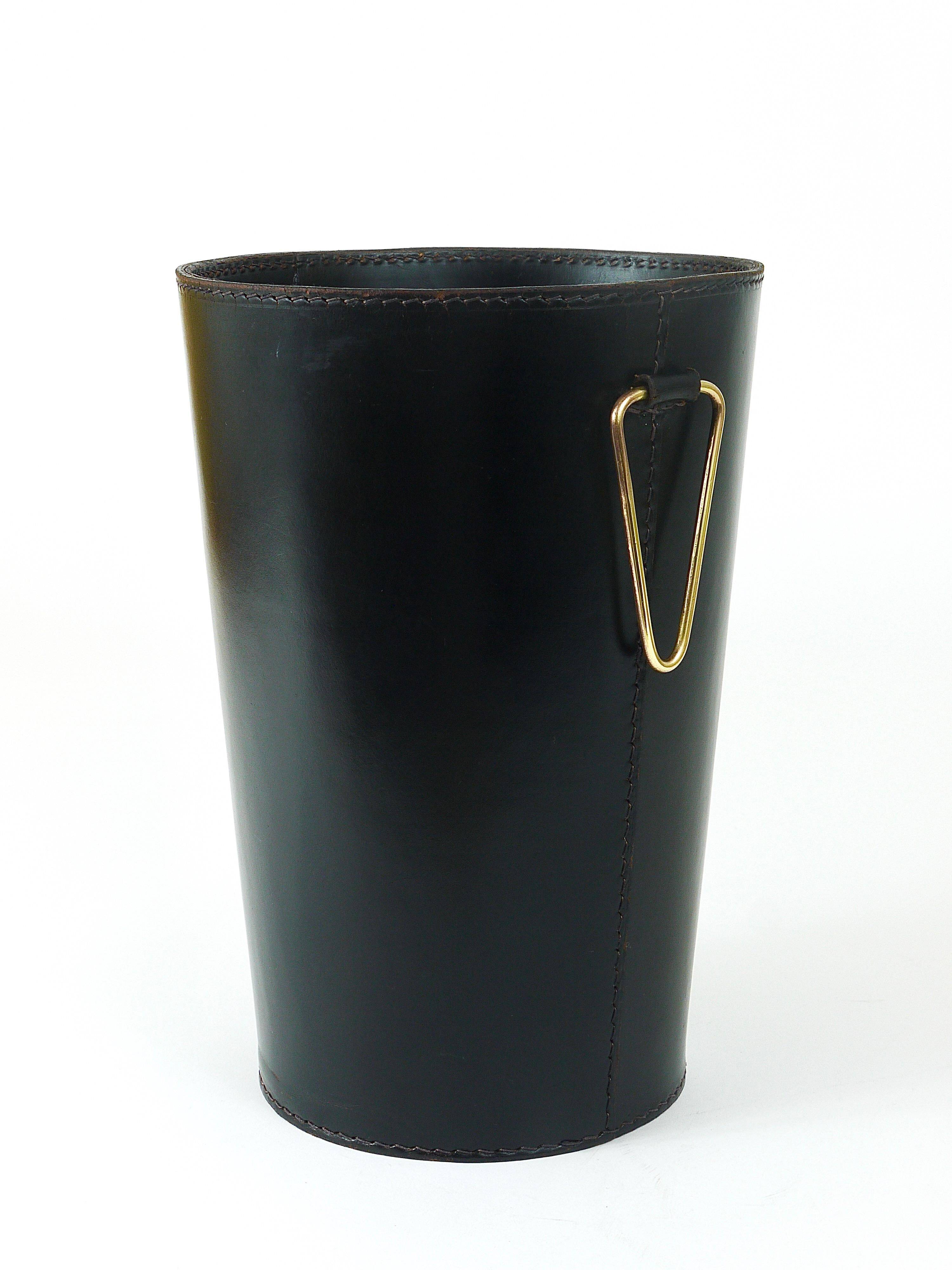 Mid-Century paper bin by Carl Auböck in black leather and brass, Austria, 1950s.