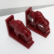 Pair of red glazed ceramic Bison ox bookends in Art Deco style, Belgium