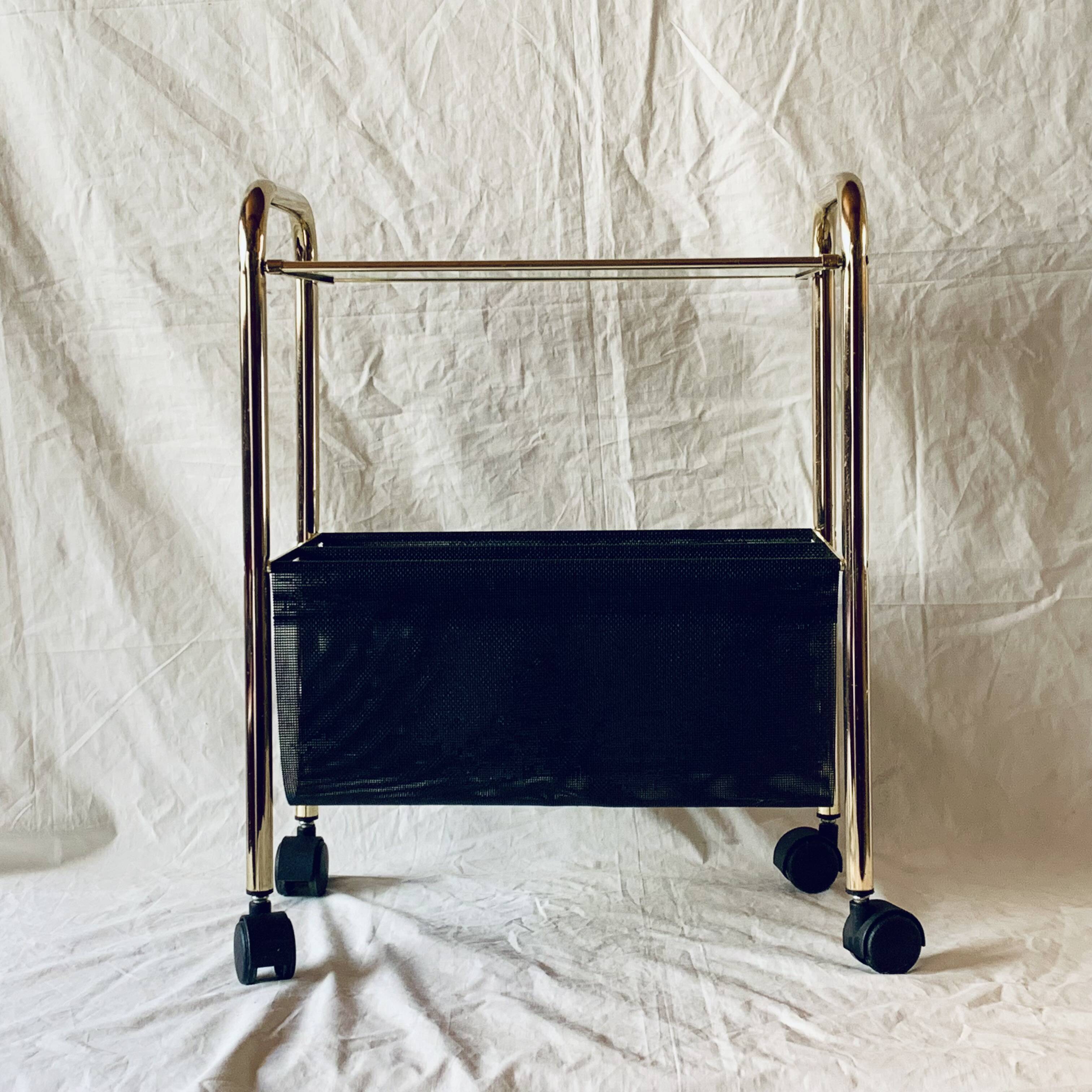 Magazine rack, saddle on vintage wheels