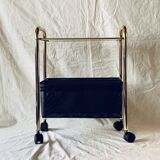 Magazine rack, saddle on vintage wheels