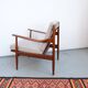Vintage teak lounge chair, retro 1960s–70s style.