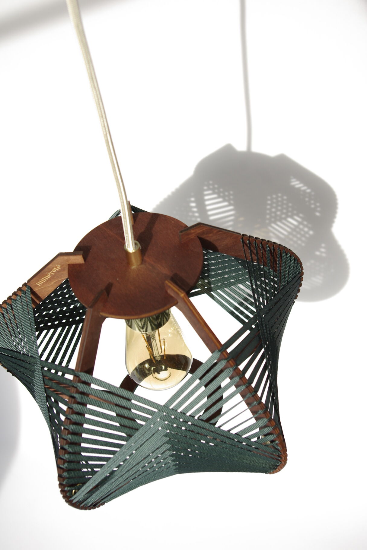 Dark green woven lamp to hang