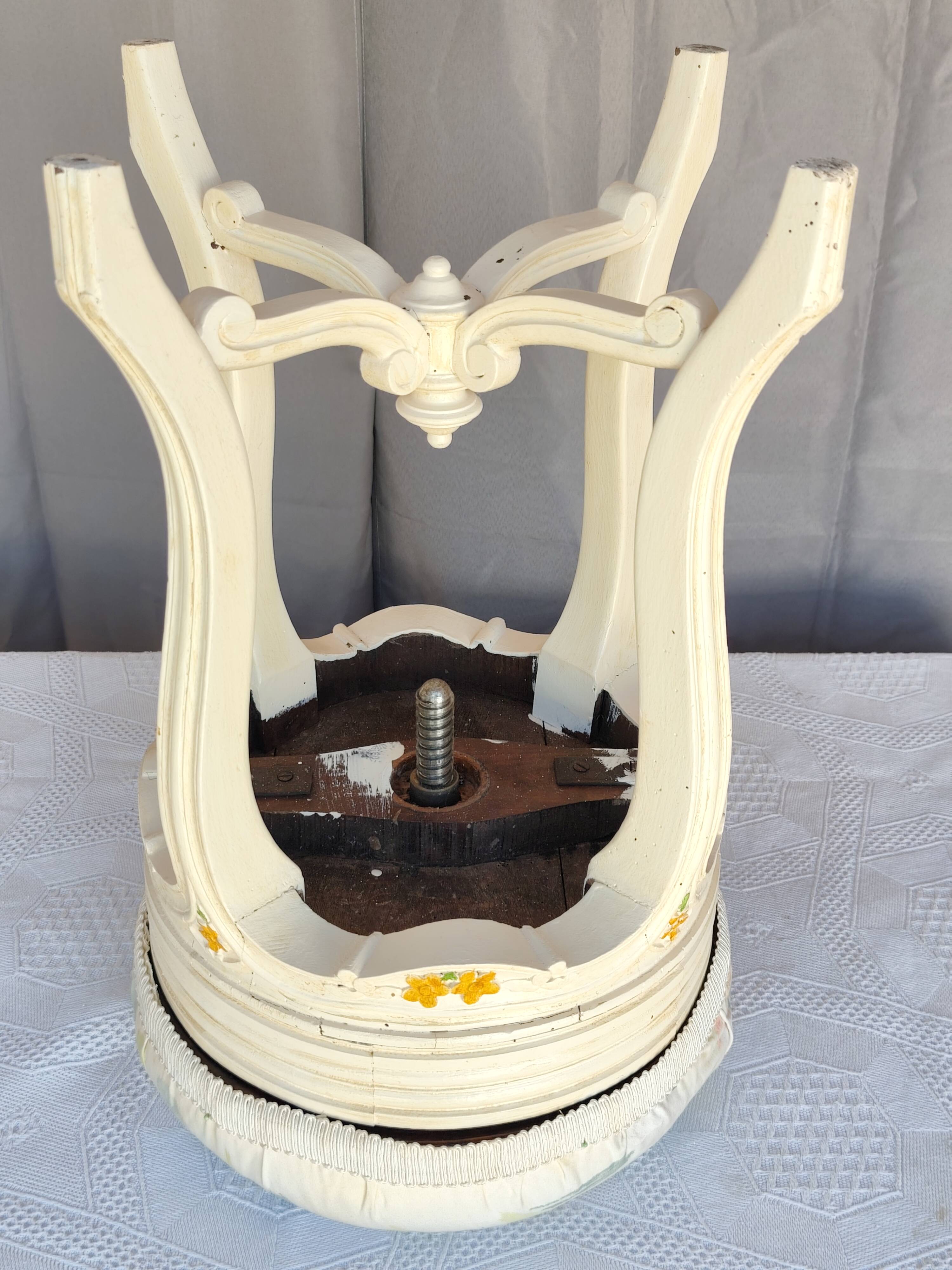 Antique upholstered stool "with screws"