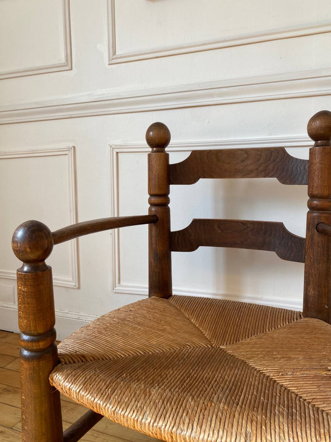 Straw and turned wood fireplace armchair in the style of Charles Dudouyt