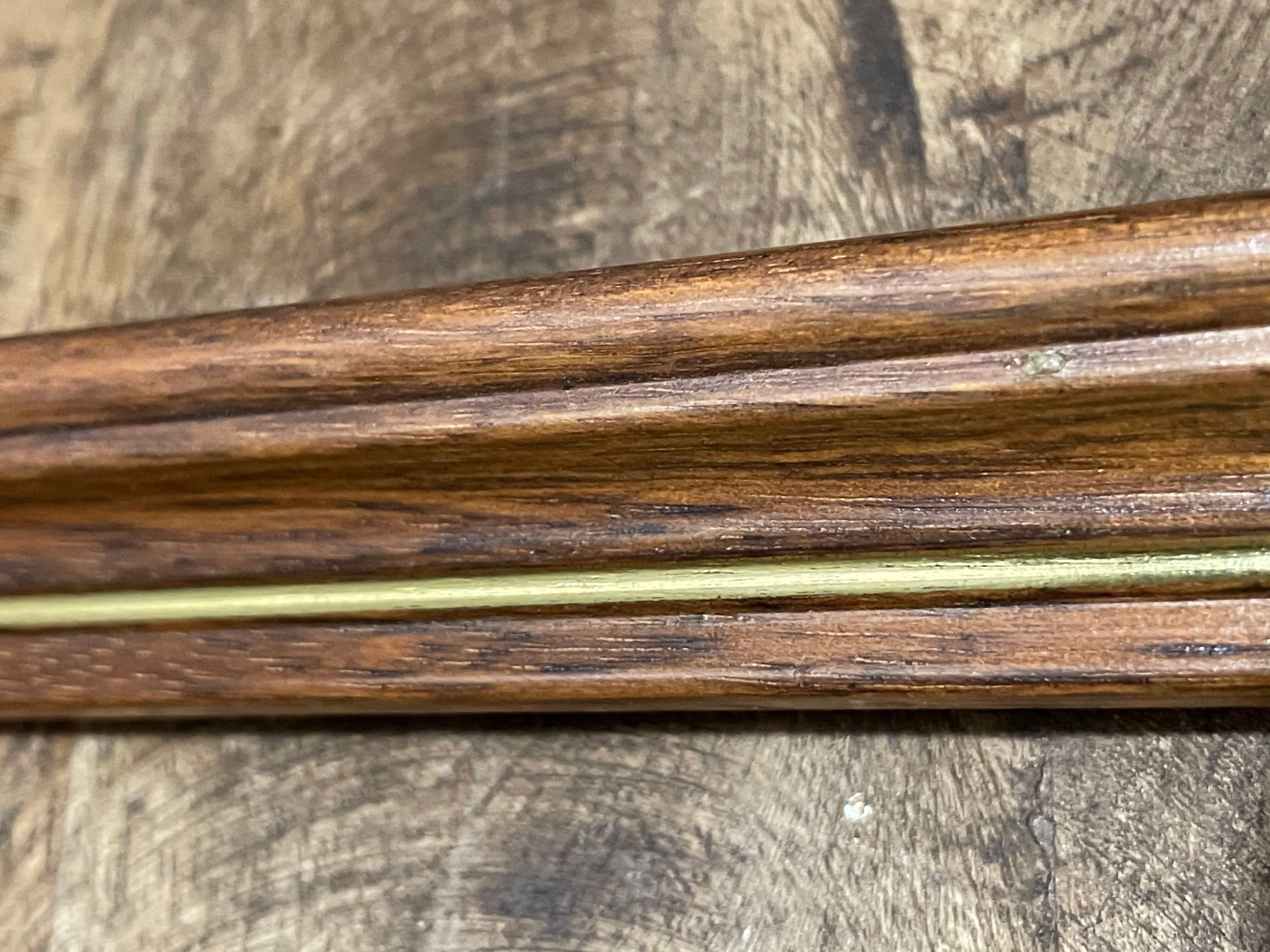 Large wooden frame with gilded outline