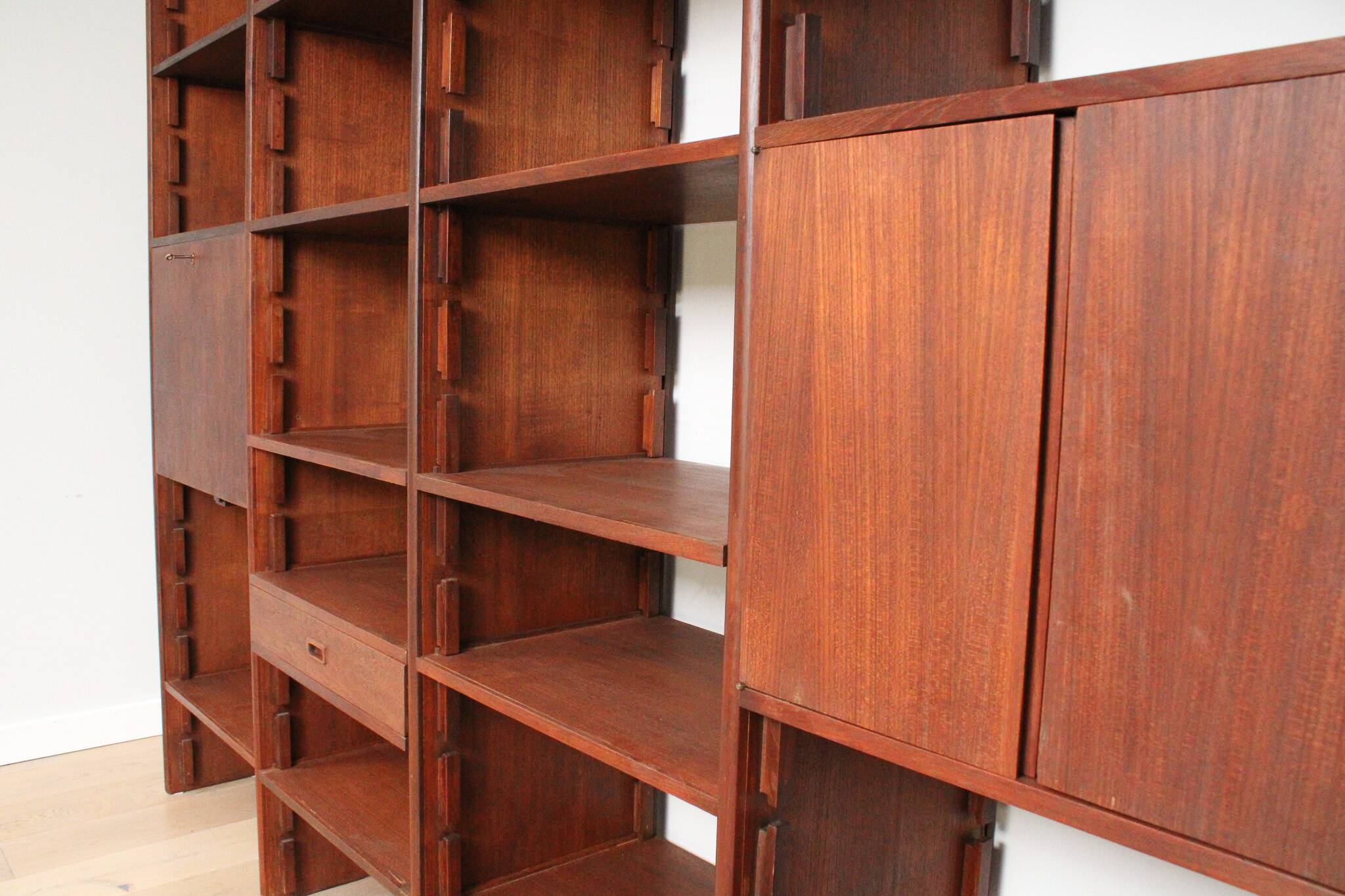 A vintage mid-century teak Gianfranco Frattini style bookcase room divider