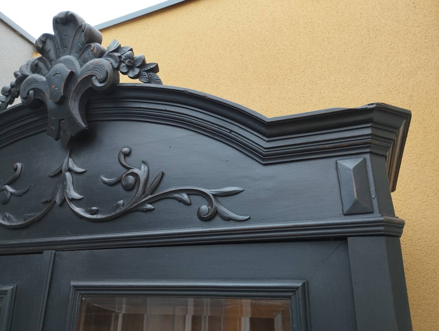 Bookcase black patina shell pediment 2 drawer doors