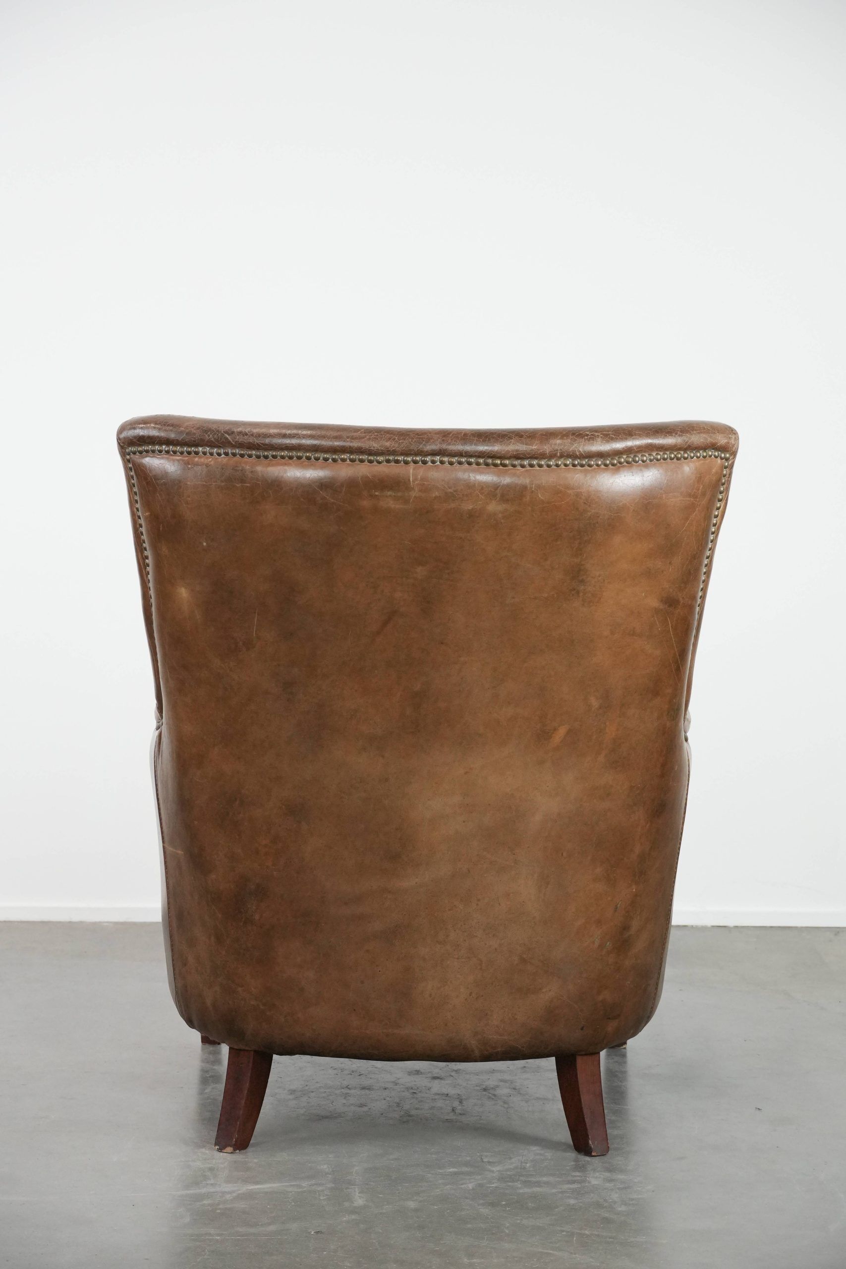 Very comfortable vintage cow leather armchair with character