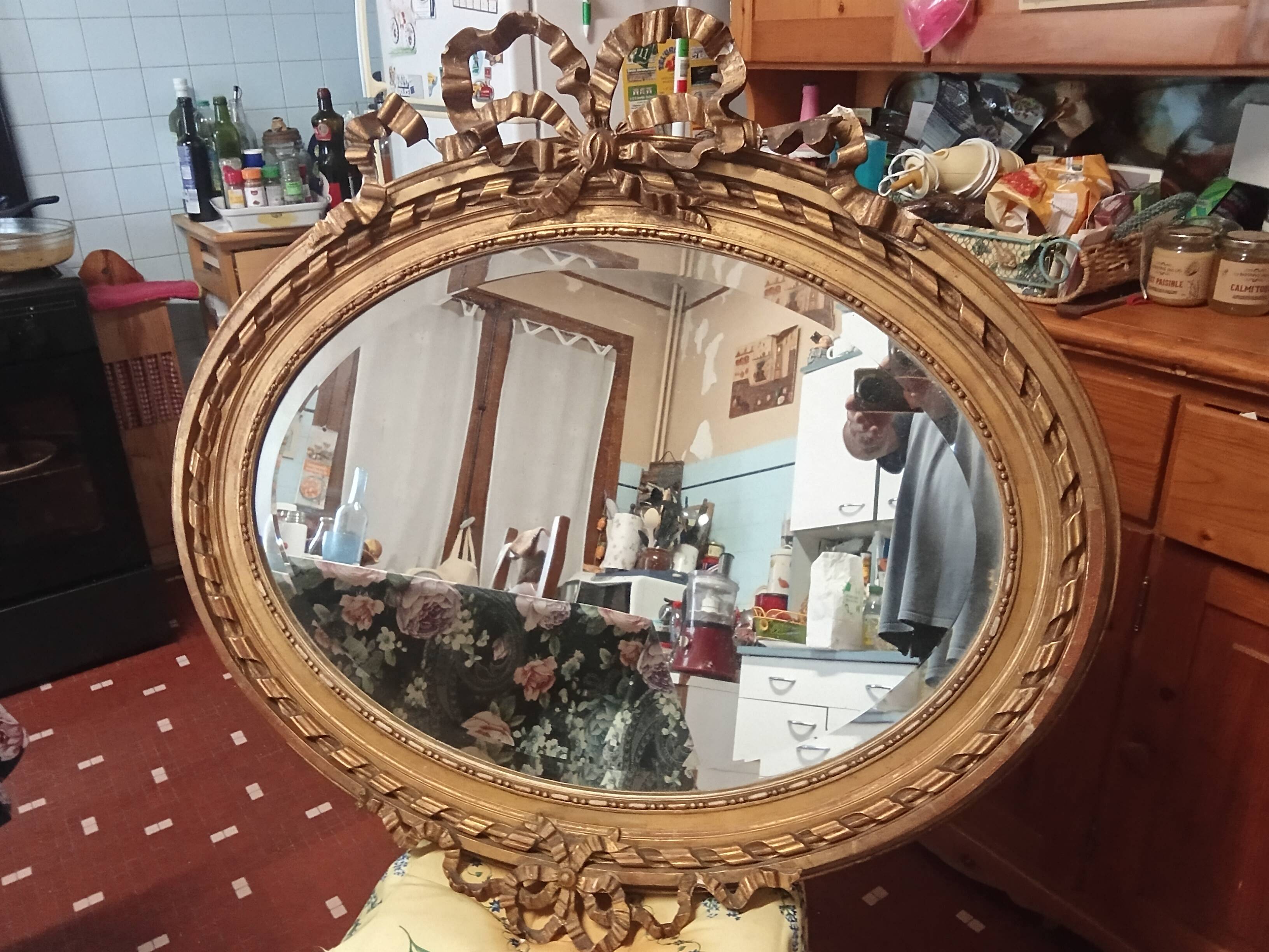 Golden leaf medallion mirror.