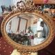 Golden leaf medallion mirror.