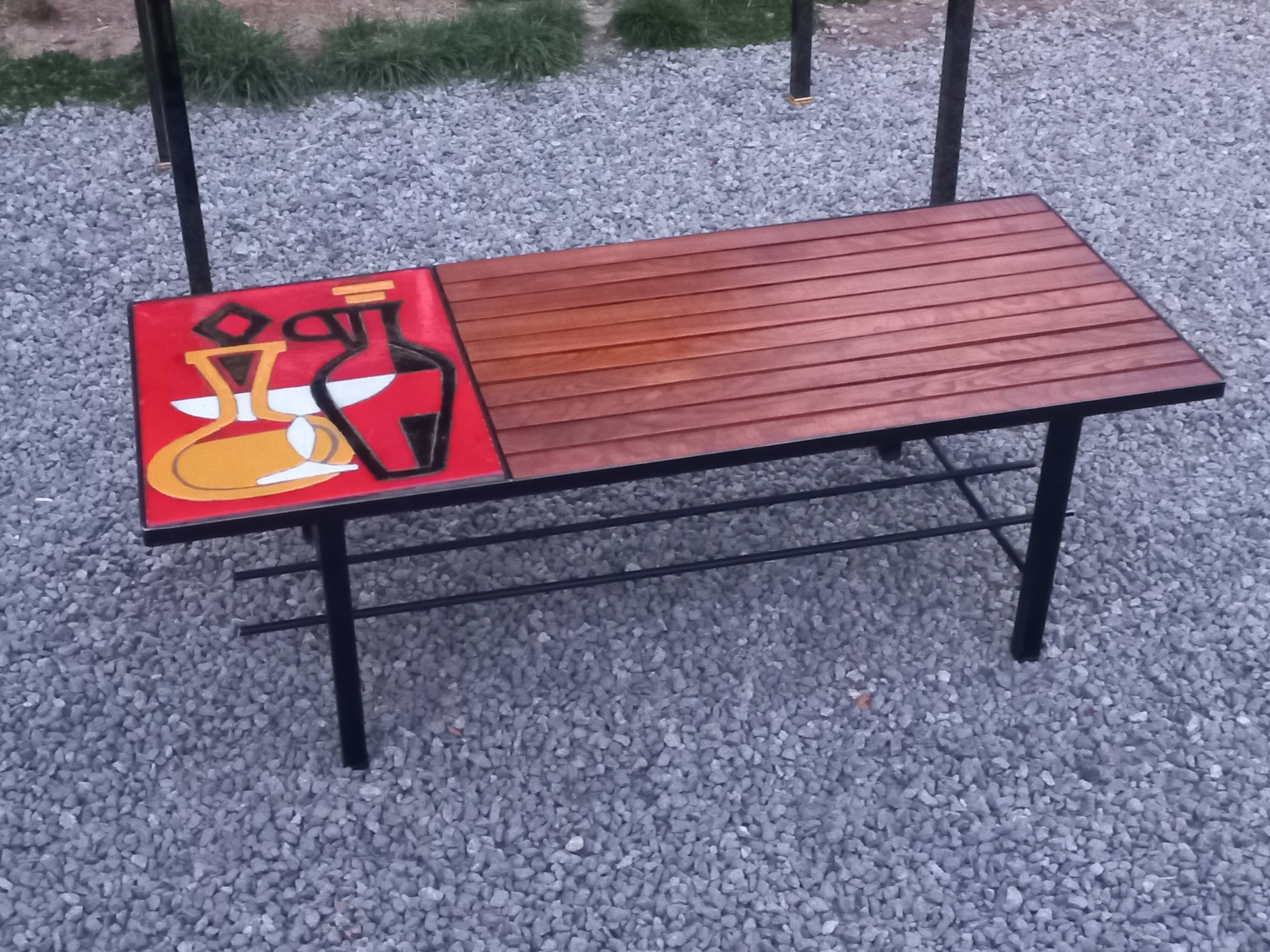 1970s design coffee table with ceramic and wood top, metal legs.