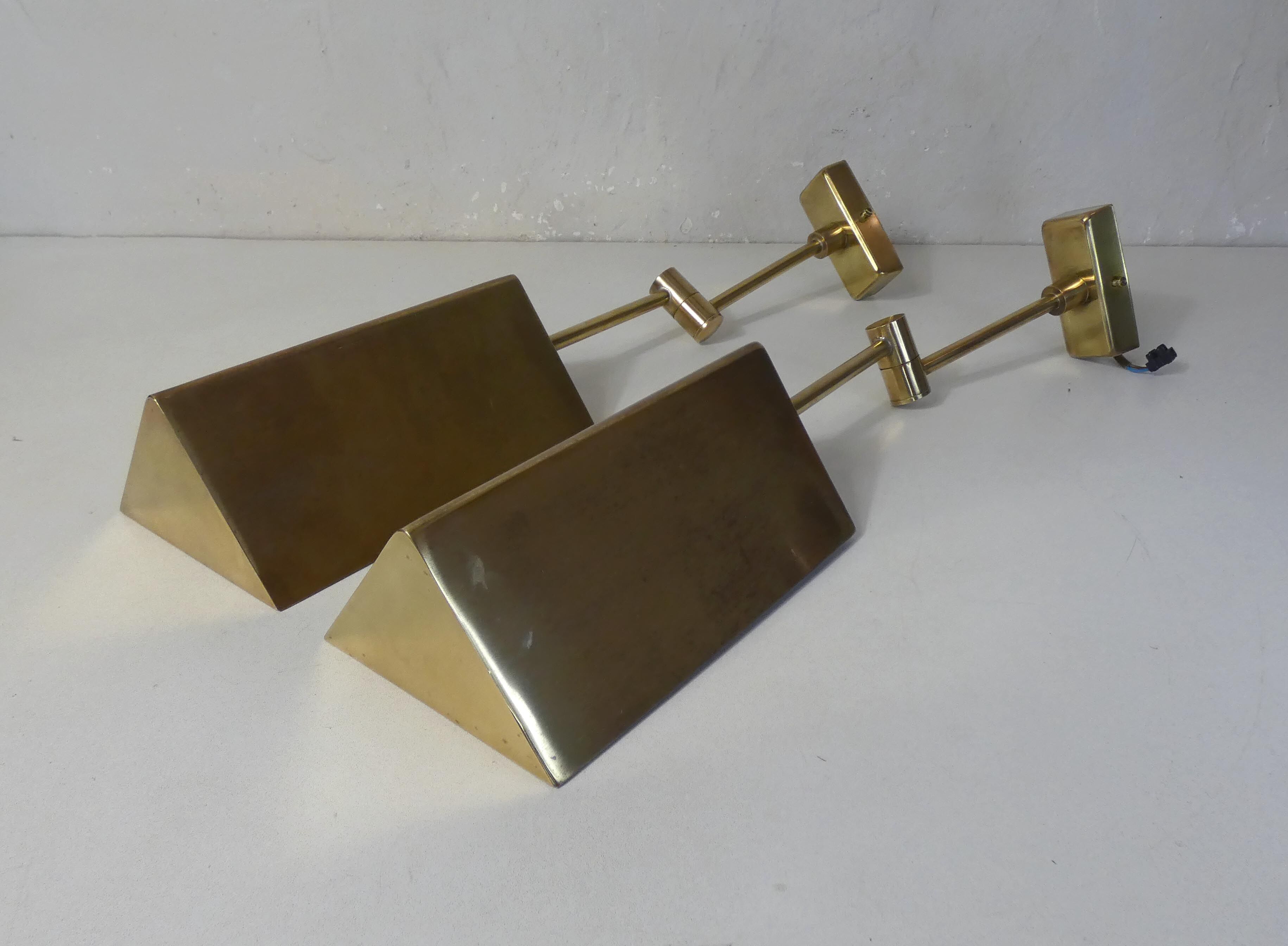 Pair of adjustable brass wall lamps after koch & lowy