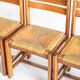 Extendable table and 4 chairs set with a rationalist design in solid elm wood. France, 70's