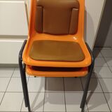 Chairs orange plastic shells seats and backrests imitation leather