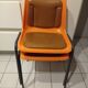 Chairs orange plastic shells seats and backrests imitation leather