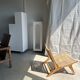 Reclining armchair in natural wood and woven rattan