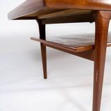 Coffee table with shelf in teak of danish design from the 1960s.