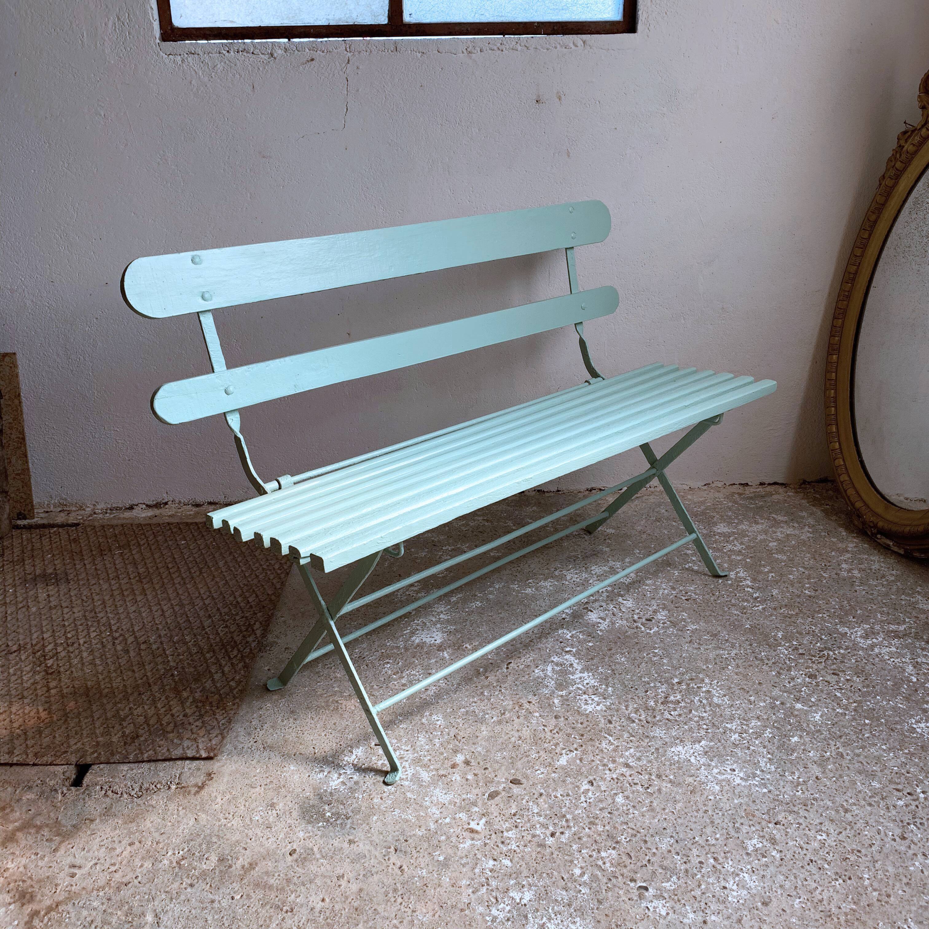 Former folding garden bench with wooden and metal slats