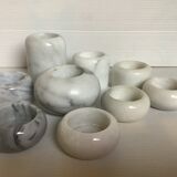 9 marble candle holders of different sizes