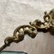 Antique oval brass crest mirror, 41x26 cm