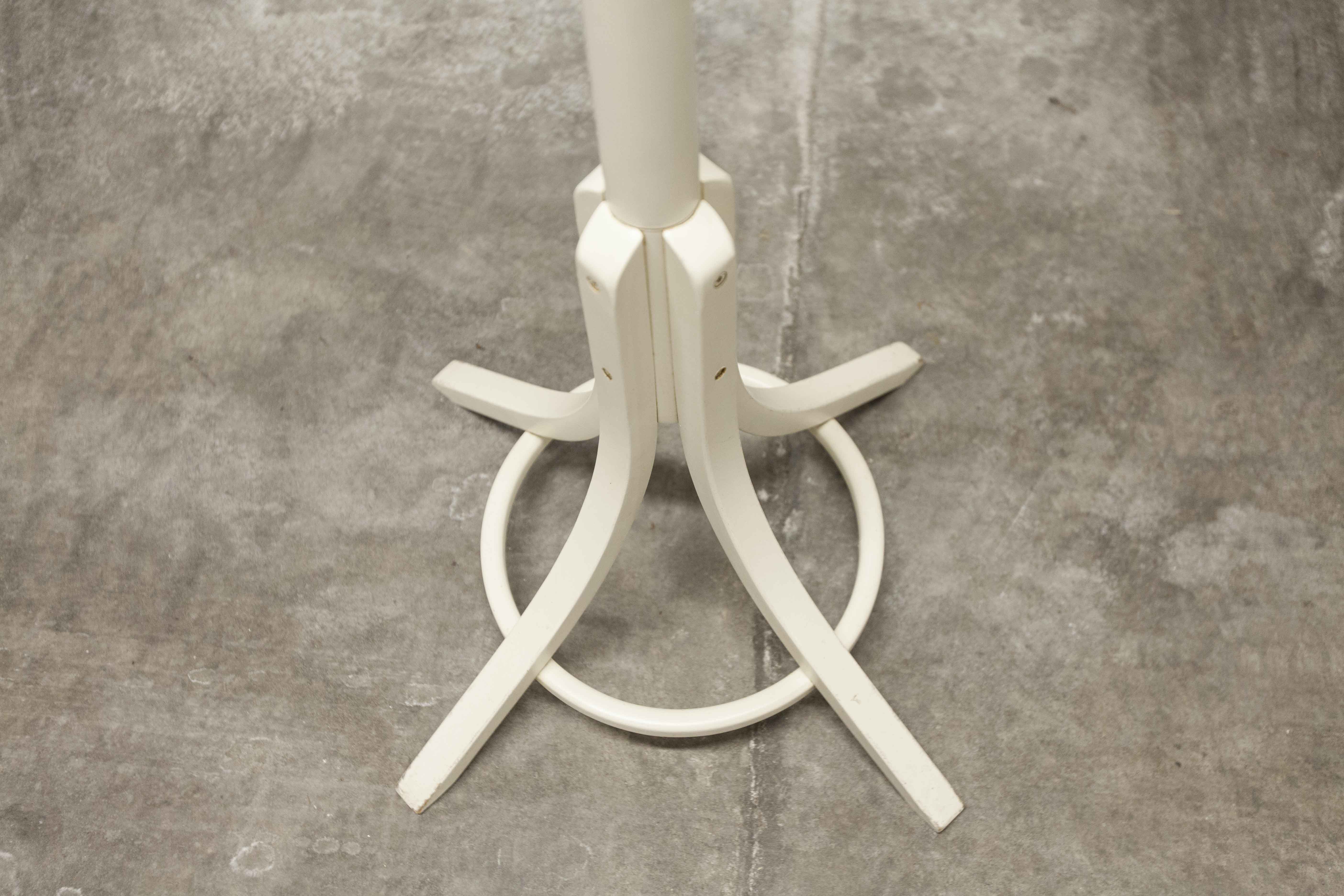 Parrot wears white Baumann coat 1970