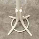 Parrot wears white Baumann coat 1970