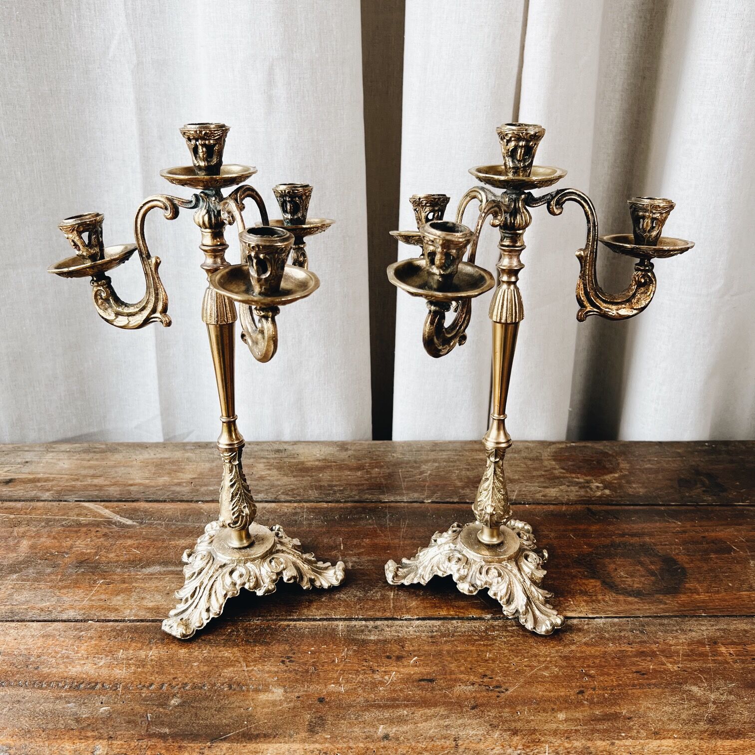 Duo of antique bronze chandeliers